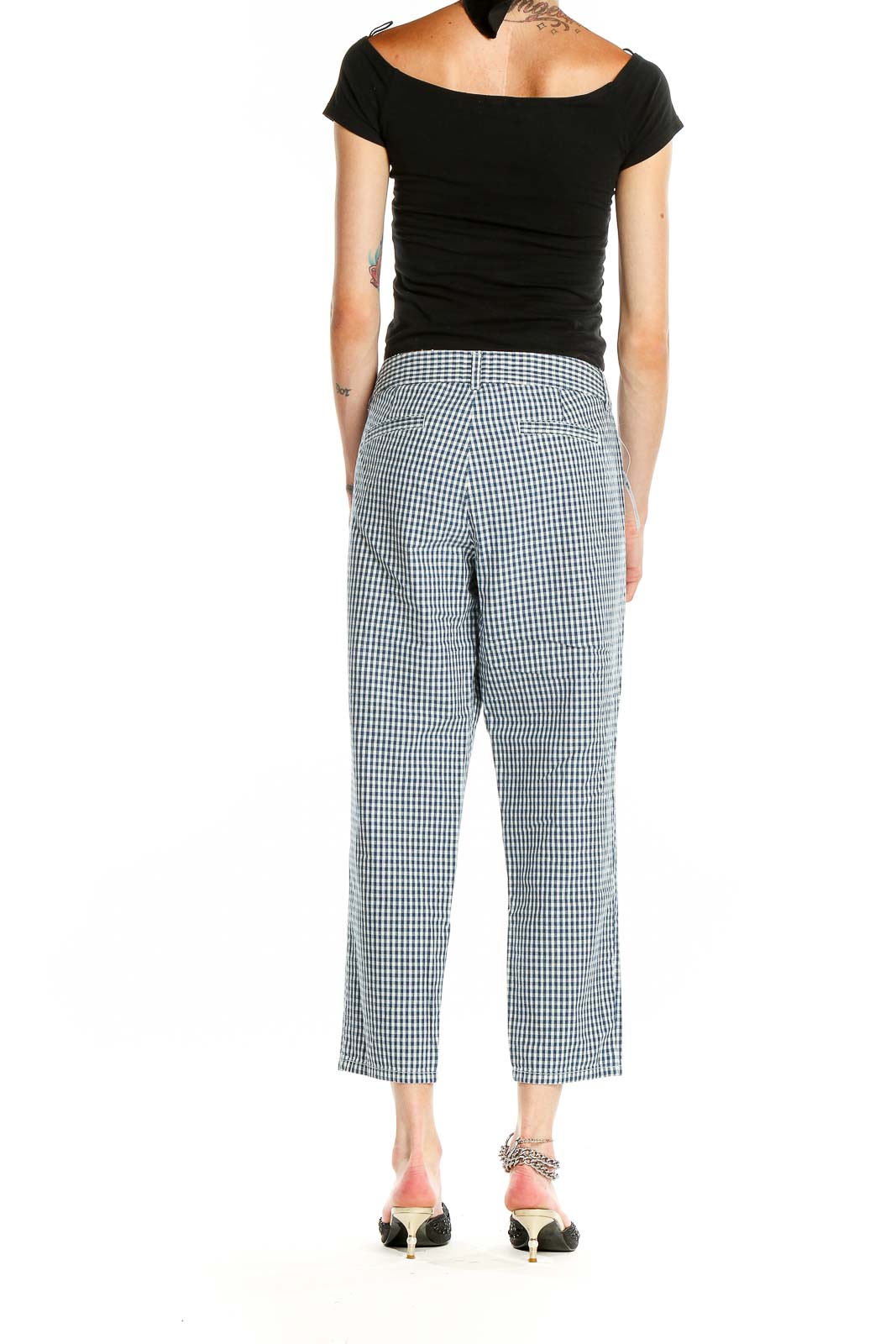 Side view of model wearing J.Crew blue and white gingham cropped pants with black top