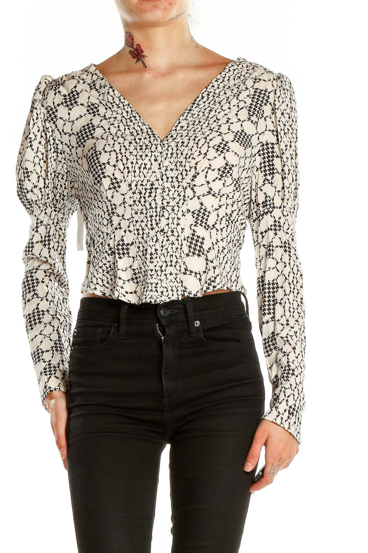 Front view of Free People Black and White Floral Lace Crop Top with puff sleeves