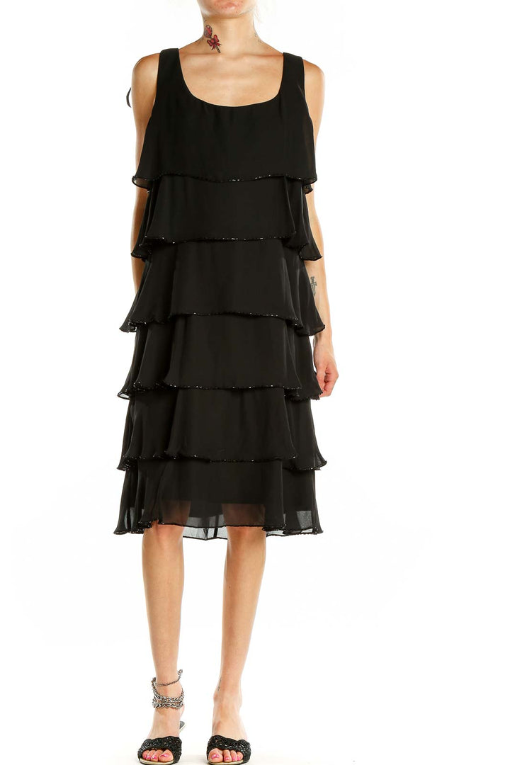 Front view of Patra black tiered chiffon cocktail dress with sequin trim