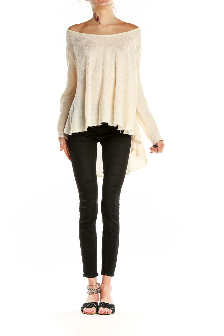 Front view of cream off-shoulder flowy knit top by Free People