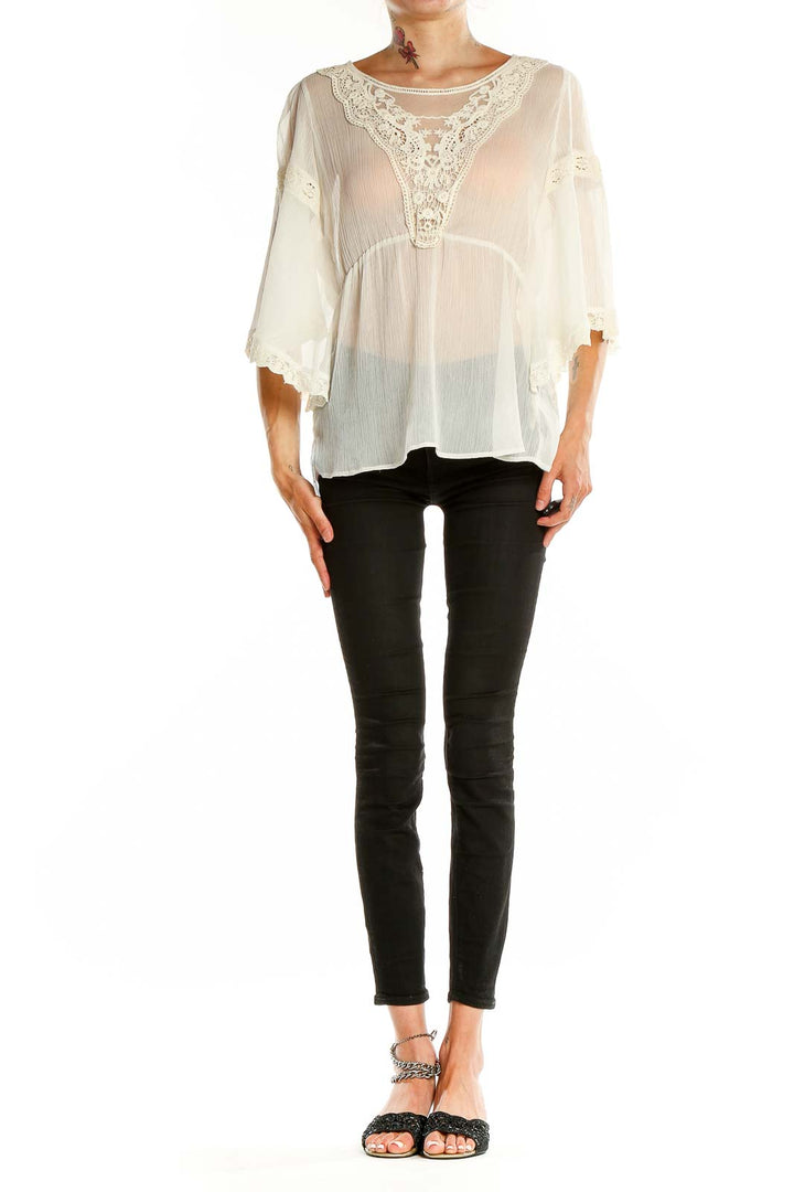 Front view of white sheer lace-trimmed boho blouse from Free People