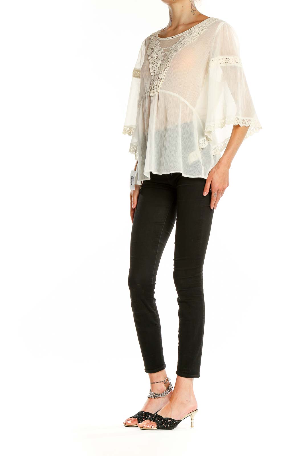 Front view of white sheer lace-trimmed boho blouse from Free People