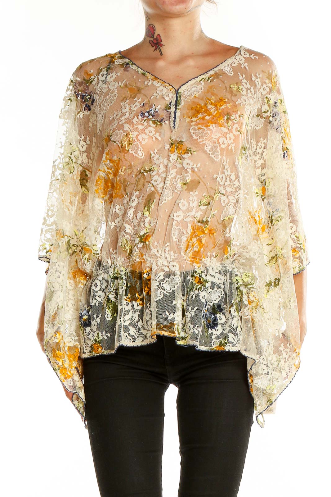 Front view of Free People beige floral lace sheer poncho top