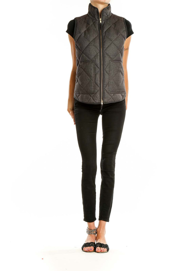 Front view of J.Crew charcoal quilted puffer vest with high collar and zipper closure