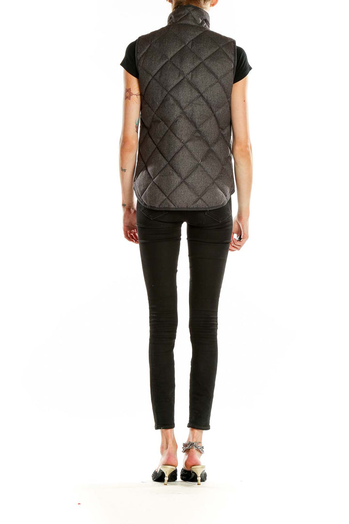 Back view of J.Crew charcoal quilted puffer vest showing diamond quilting pattern