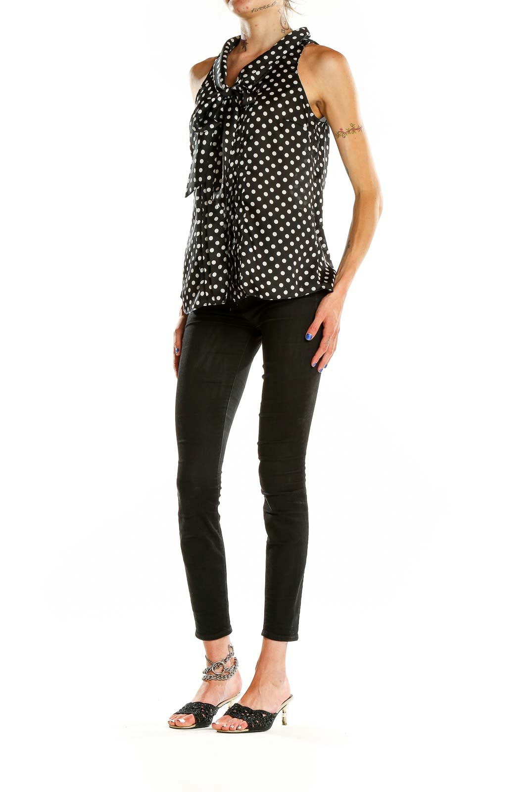 Front view of Black and White Polka Dot Sleeveless Blouse with tie-neck detail