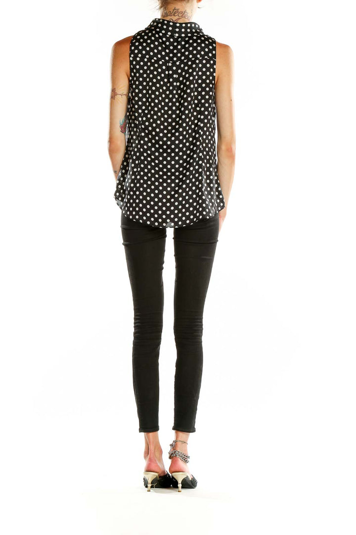 Back view of Black and White Polka Dot Sleeveless Blouse showing flowy silhouette