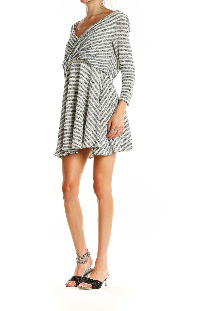 Front view of Free People gray striped cotton wrap dress with twisted front design