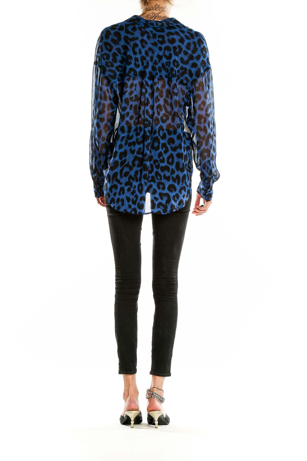 Back view of blue leopard print sheer blouse from Free People showing high-low hemline