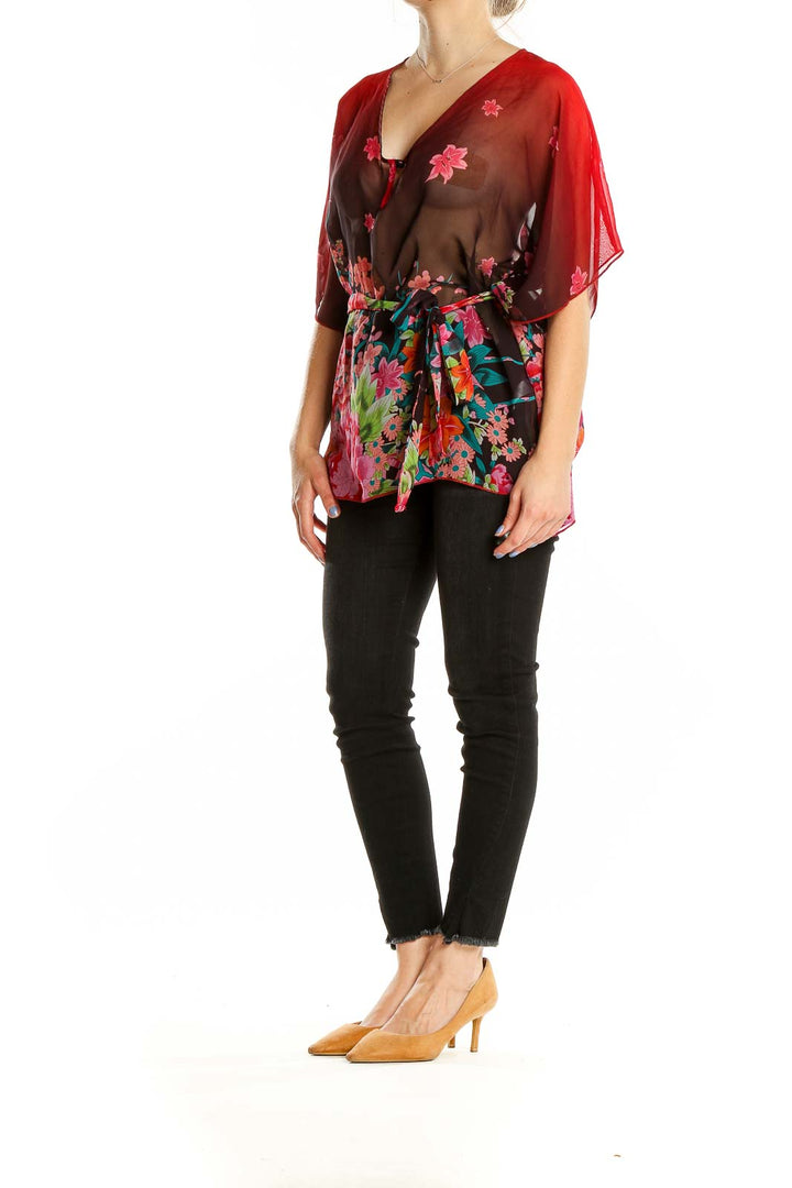 Front view of OBR red floral sheer chiffon blouse with V-neck and butterfly sleeves