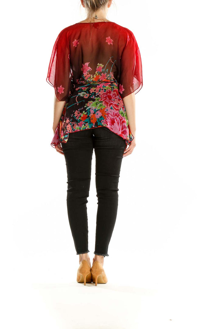 Back view of OBR red floral sheer chiffon blouse showing wrap design and flowy silhouette