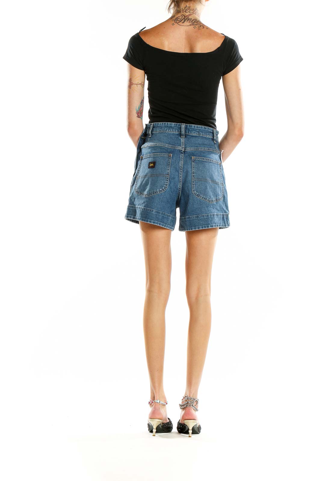 Back view of Lee blue denim high-waisted shorts on model