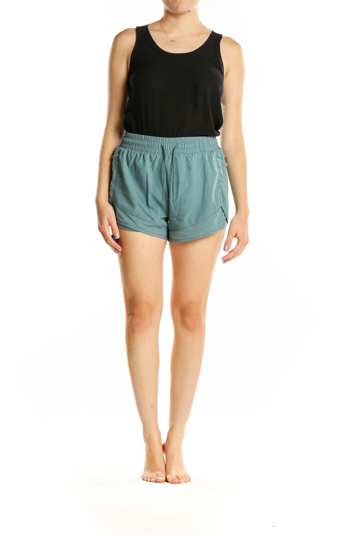 Front view of teal SilkRoll athletic shorts with mesh details