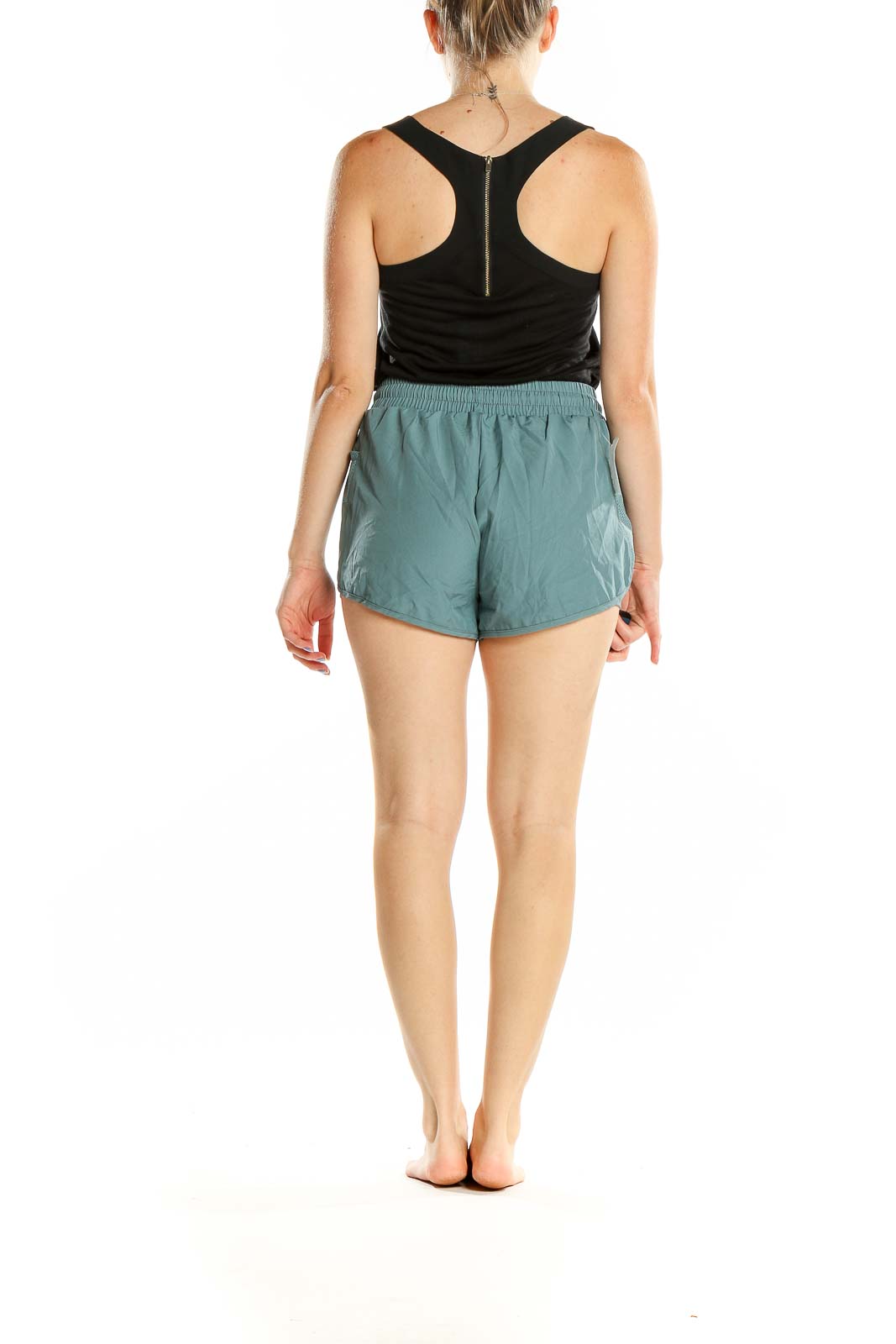 Back view of teal SilkRoll athletic shorts on model