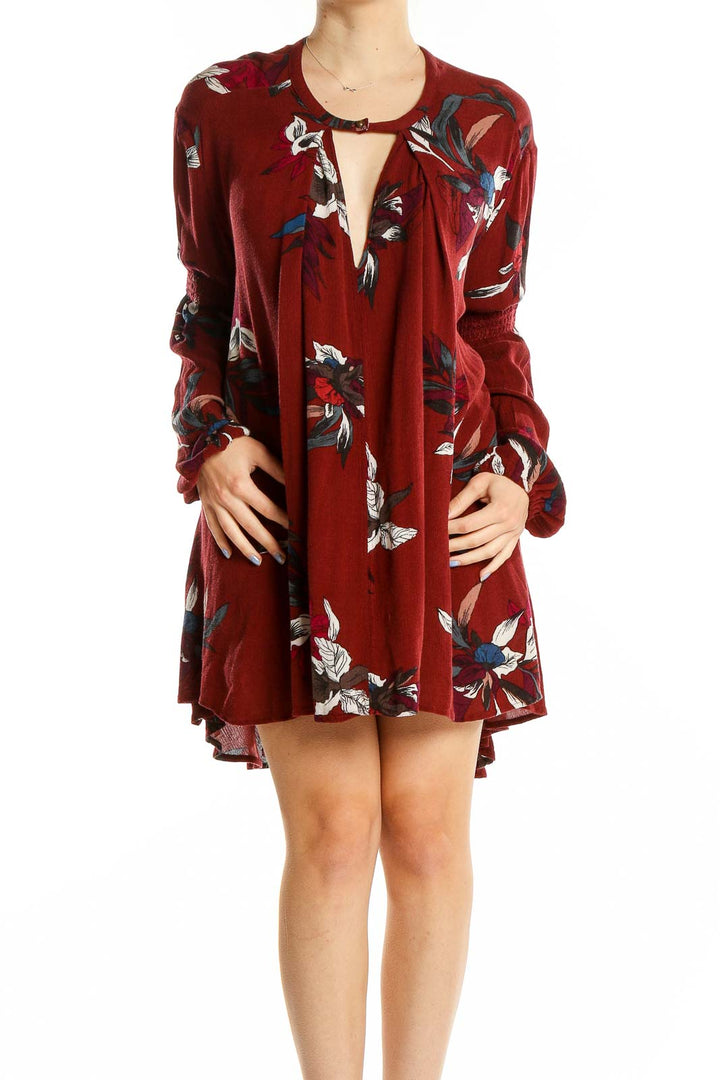 Front view of burgundy floral long sleeve mini dress by Free People