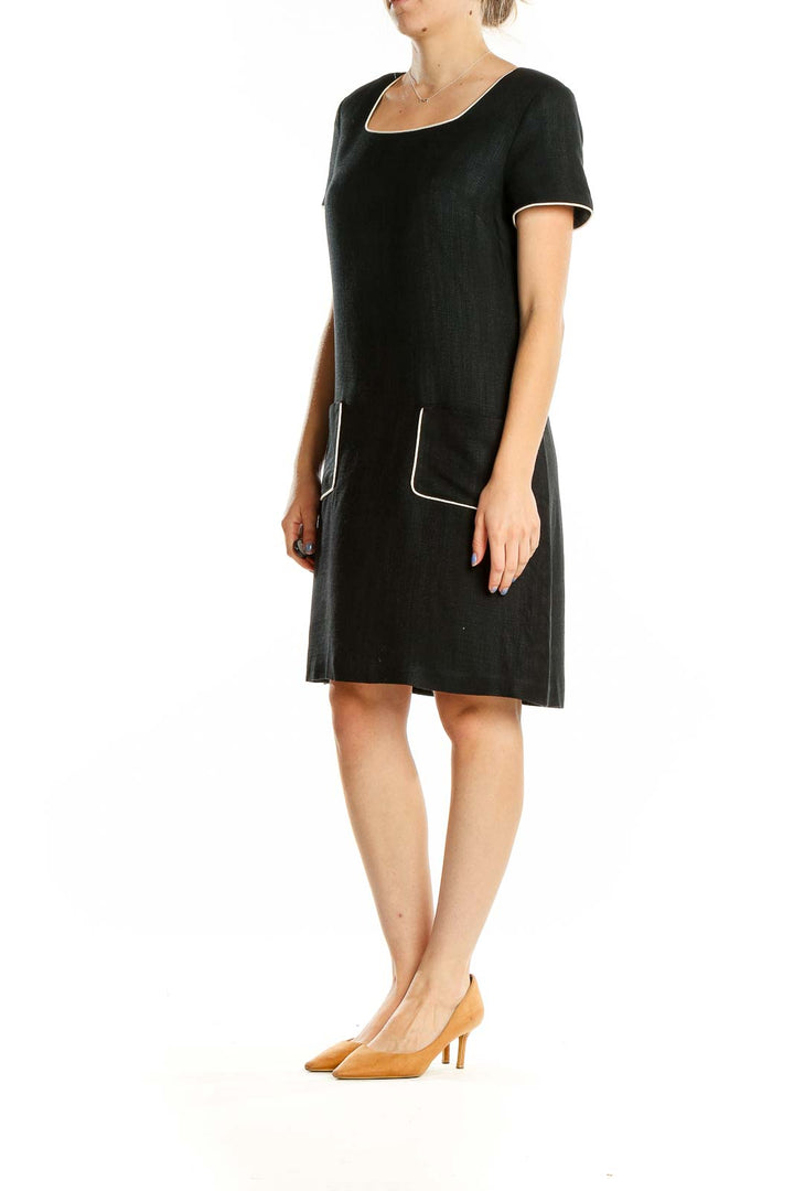 Front view of Donna Ricco black A-line dress with square neckline and pockets