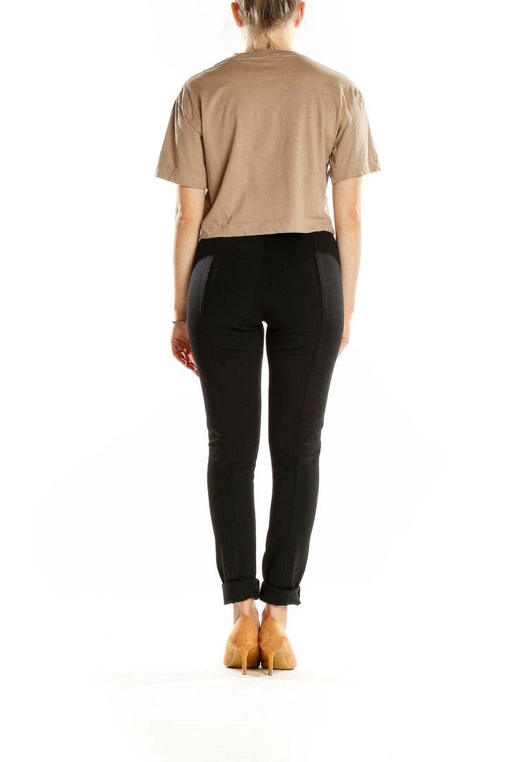 Back view of beige Everlane crop top showing plain design