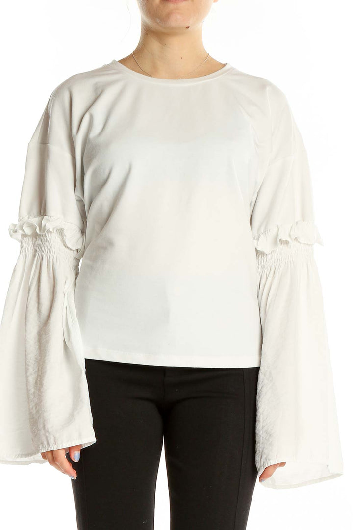 Front view of white Gilli top with bell sleeves and ruffle details