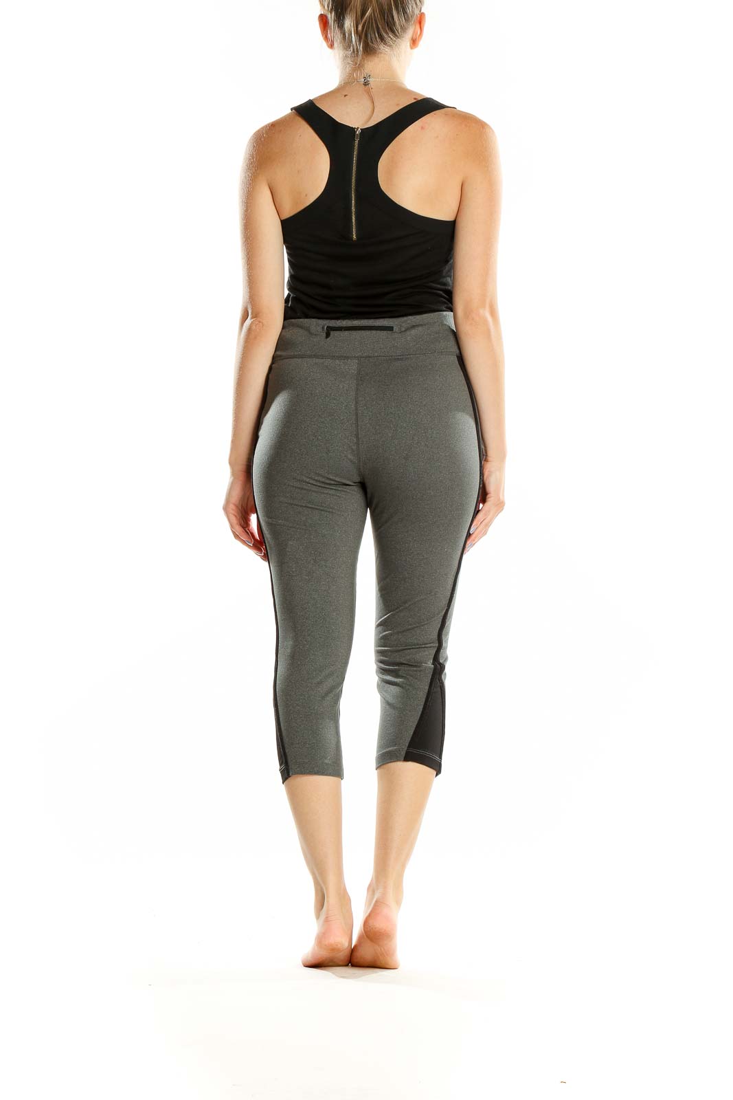 Side view of woman wearing gray Lauren Ralph Lauren capri activewear leggings