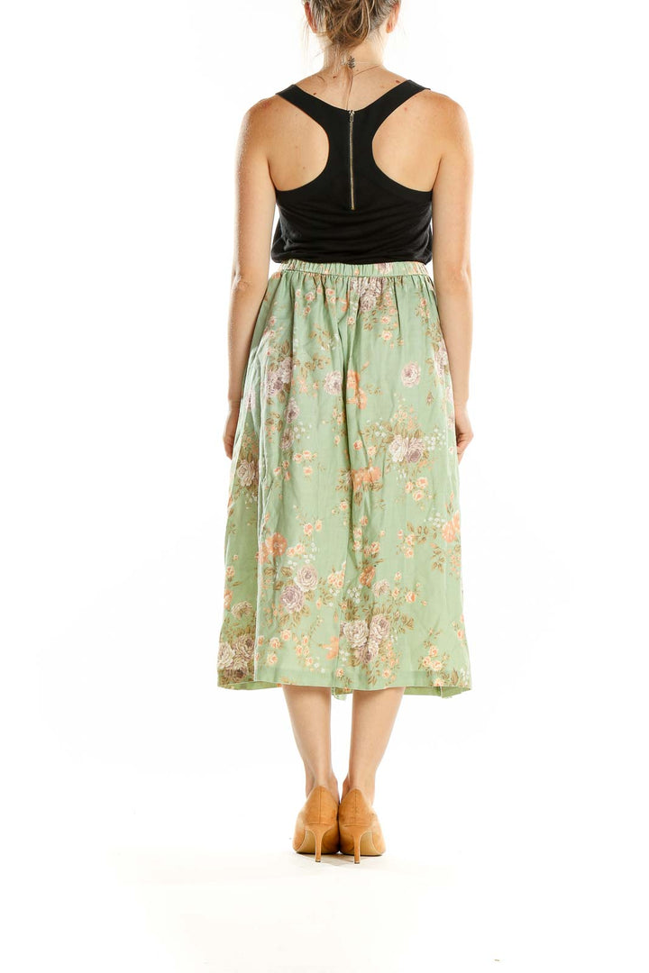 Back view of Alfred Dunner mint green floral midi skirt on model