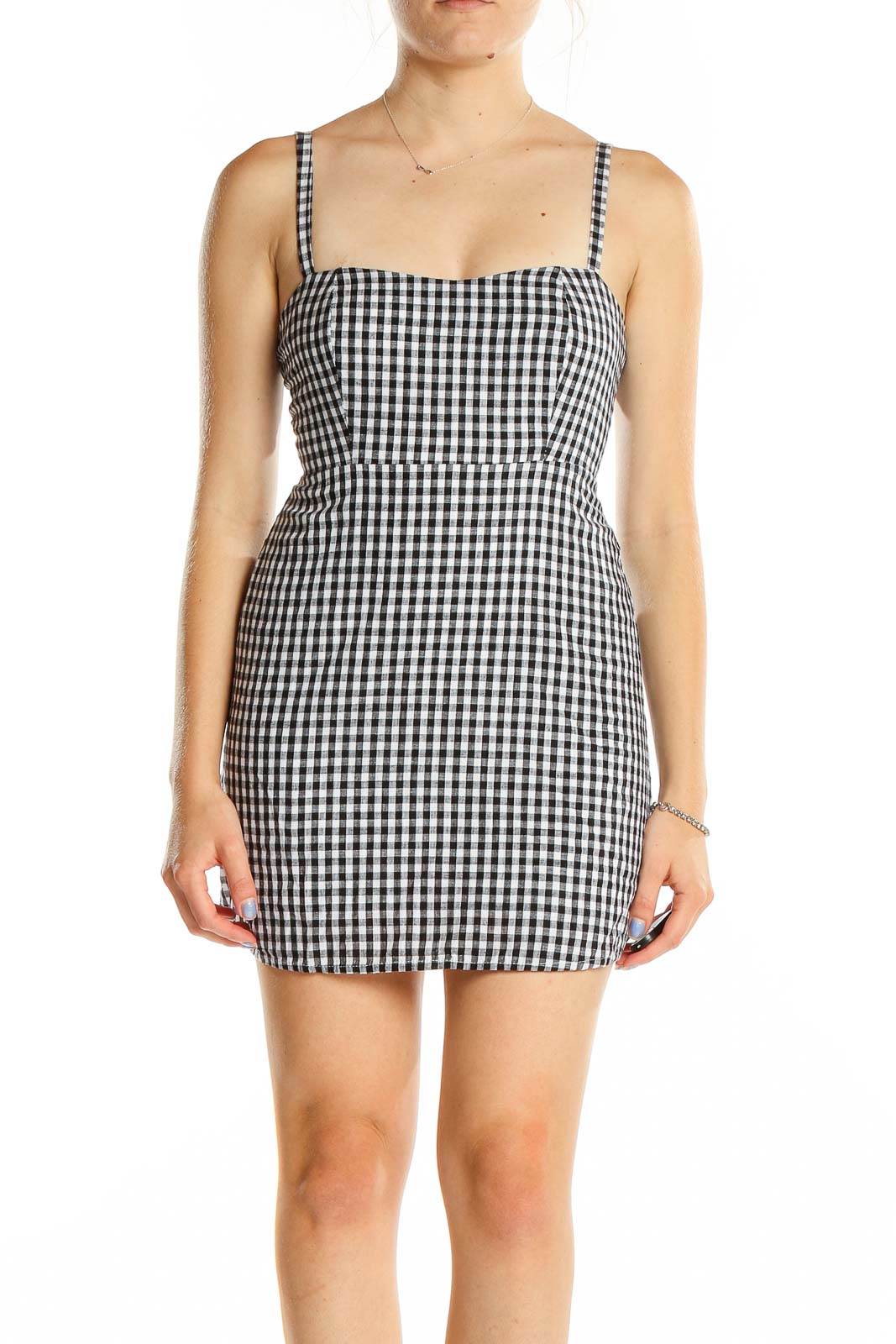 Front view of black and white gingham mini dress with thin straps