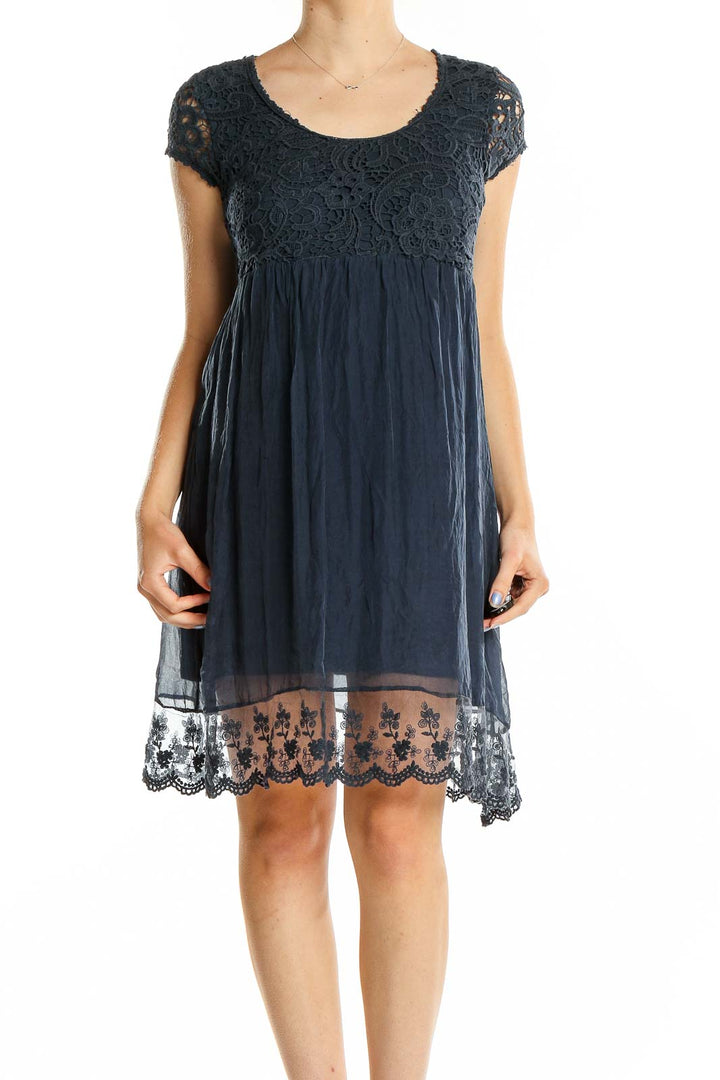 Front view of Piazza Roma navy lace bodice empire waist dress