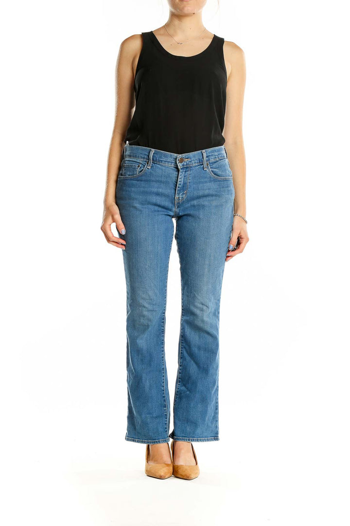 Front view of Levi's blue bootcut jeans on model