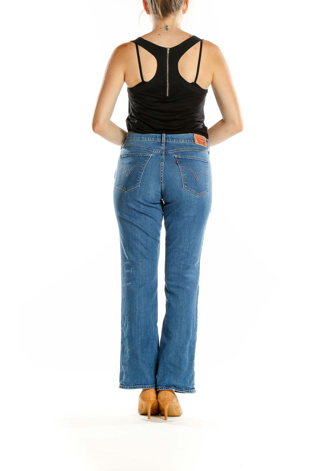 Back view of Levi's blue bootcut jeans on model