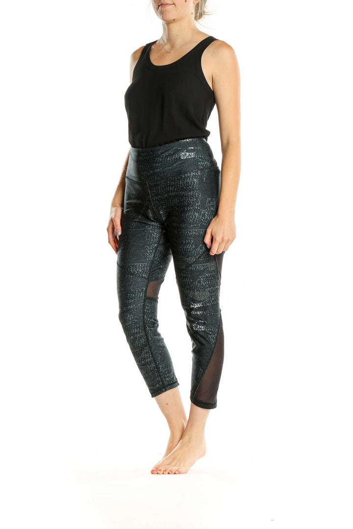 Front view of Under Armour black patterned capri leggings with high waist