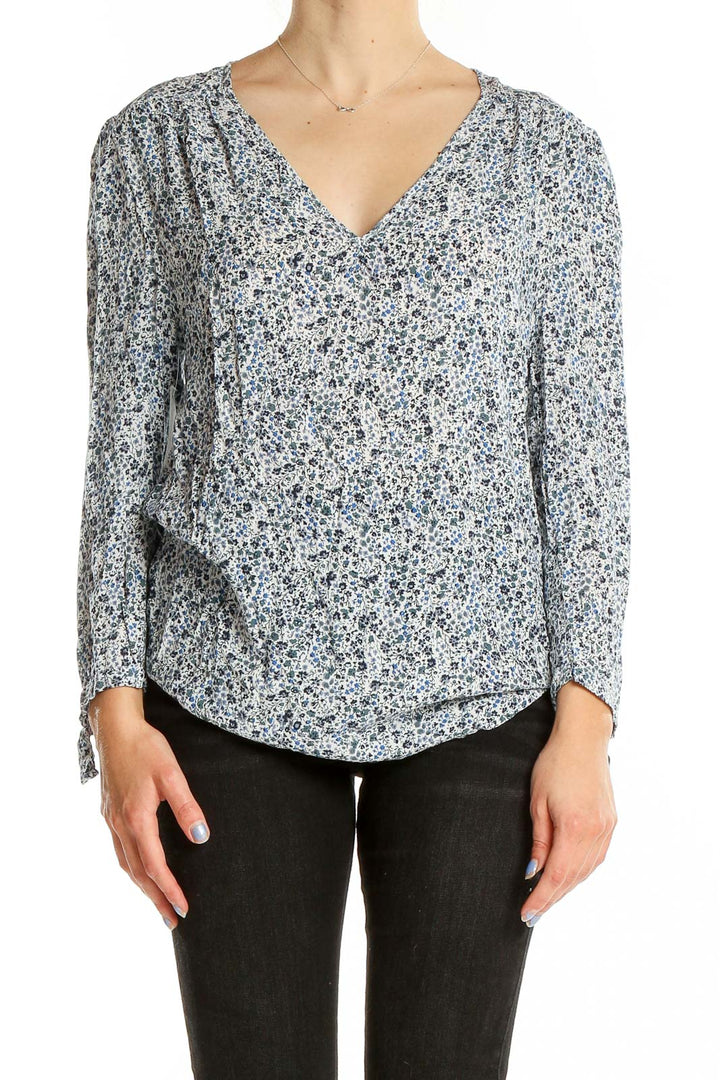 Front view of Cynthia Rowley blue floral print rayon blouse with V-neck