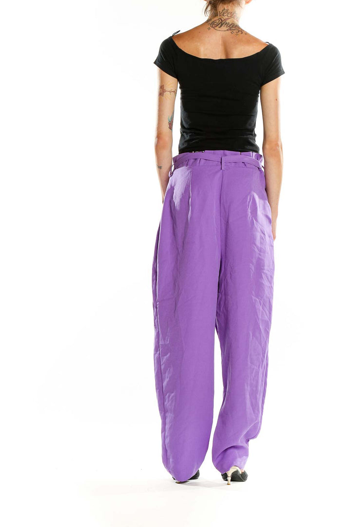 Back view of ASOS purple wide-leg trousers on model