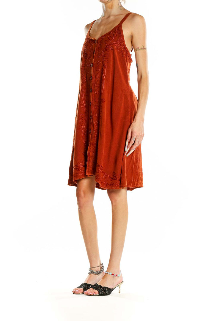 Front view of rust-colored JackPot sundress with embroidery and button-front design