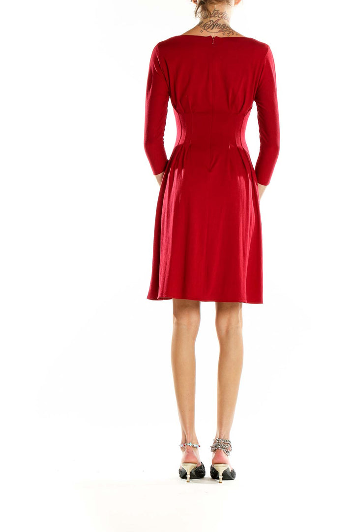 Back view of Kay Unger red fit-and-flare dress showing fitted waist and A-line skirt