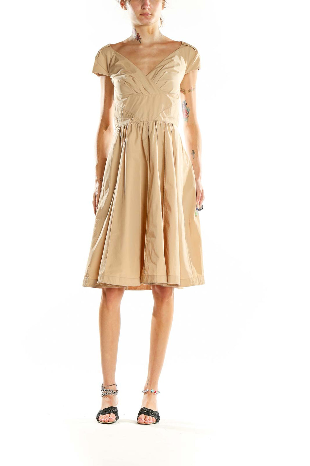 Front view of beige Pink Tartan V-neck cocktail dress with gathered waist