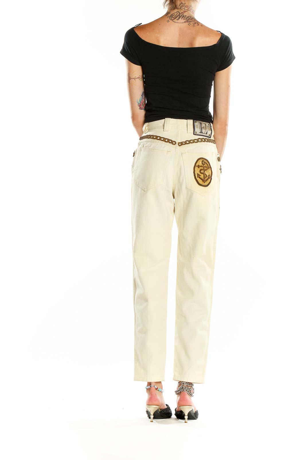 Back view of cream Escada Margaretha Ley jeans showing embroidered logo patch