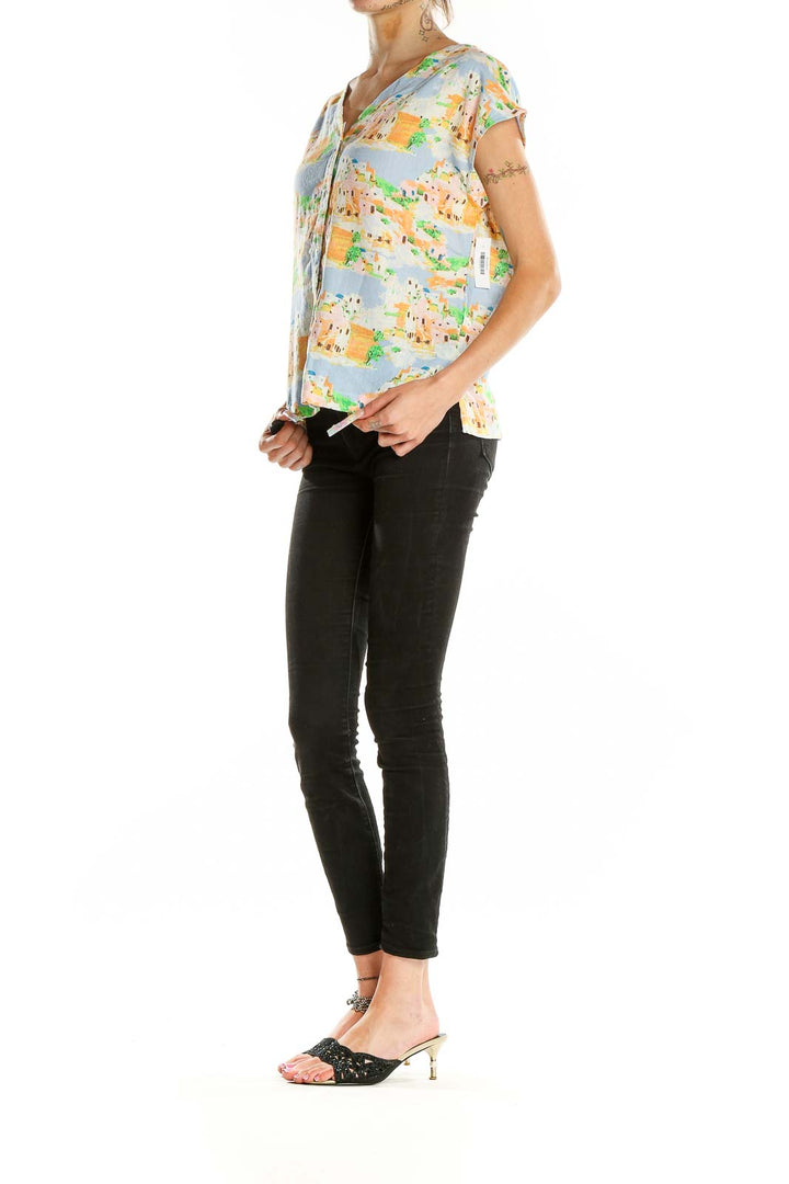 Front view of Cynthia Rowley pastel cityscape print V-neck blouse