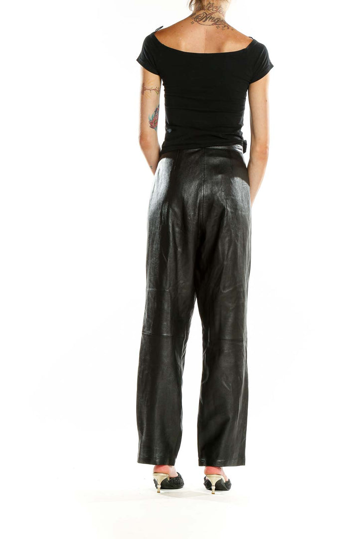 Back view of MIxit black genuine leather wide-leg pants on model