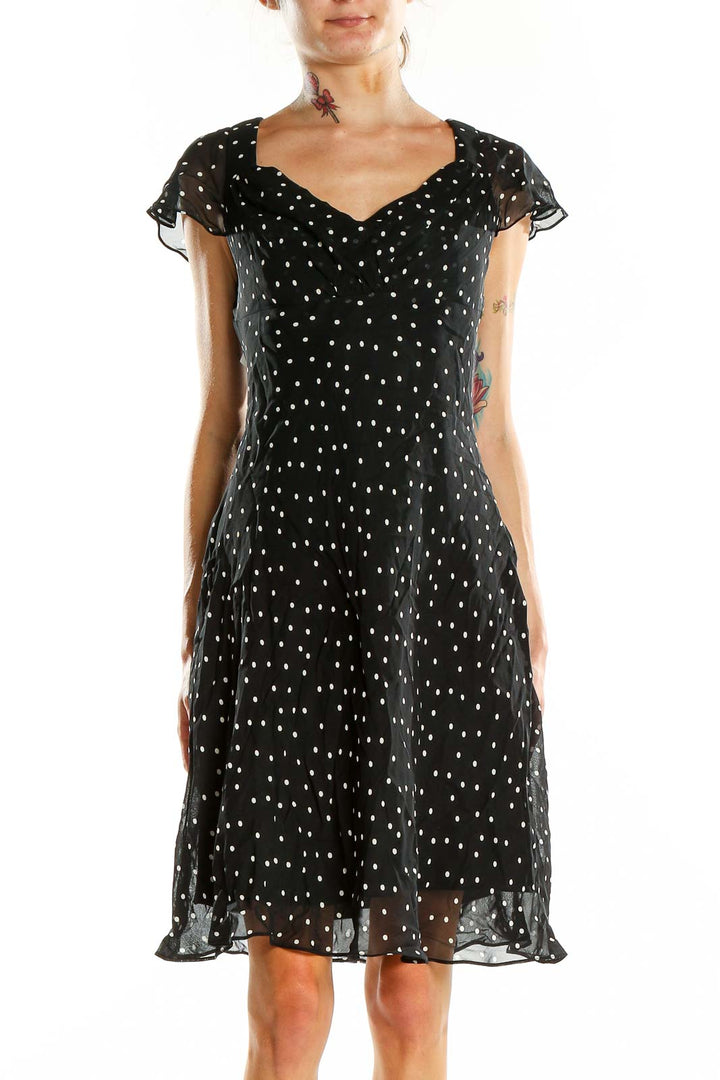 Front view of Evan Picone black polka dot dress with flutter sleeves and sweetheart neckline