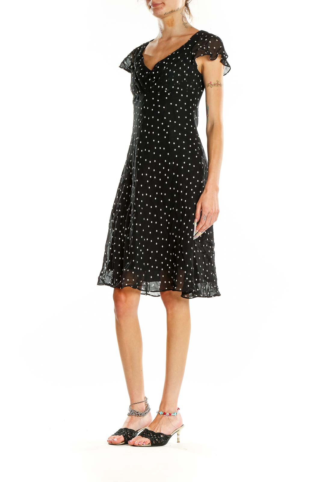 Front view of Evan Picone black polka dot dress with flutter sleeves and sweetheart neckline