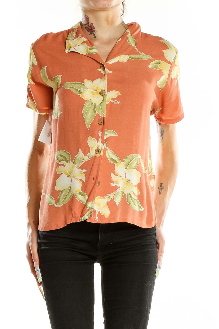 Front view of Tommy Bahama orange shirt with yellow hibiscus print