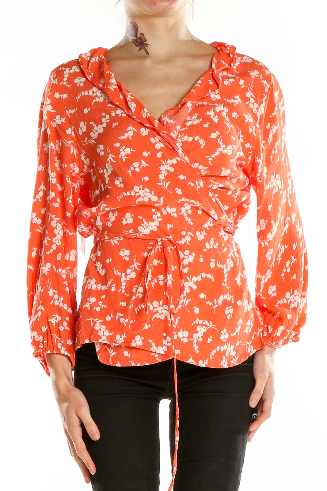 Front view of Gap orange floral wrap blouse with V-neck and waist tie