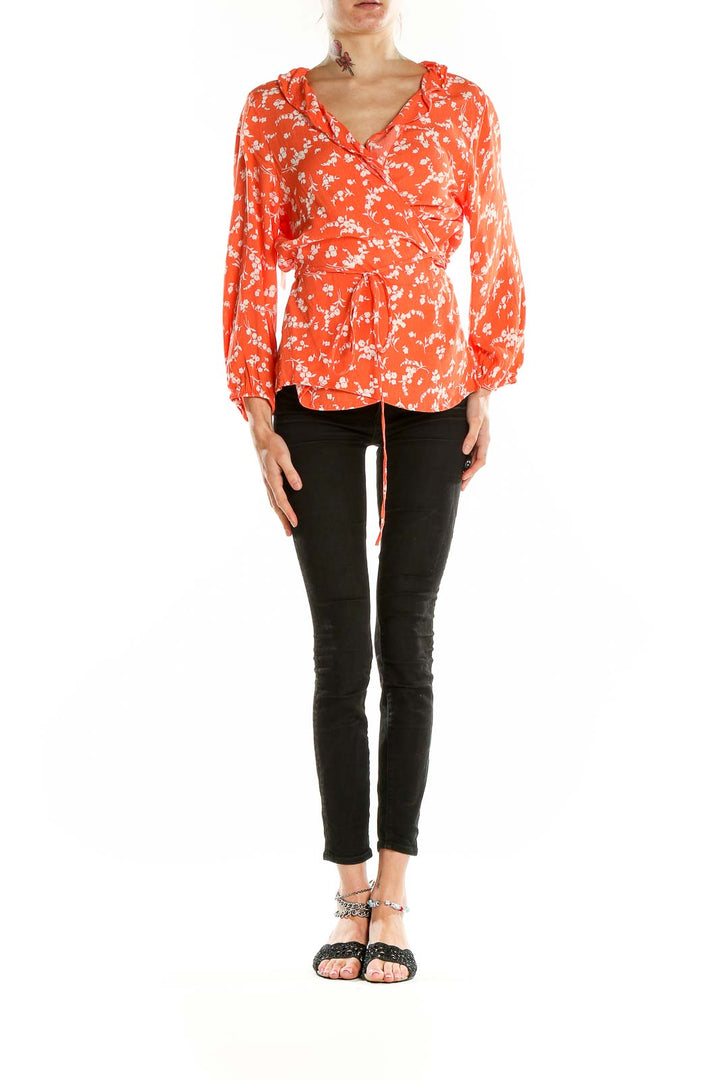 Front view of Gap orange floral wrap blouse with V-neck and waist tie