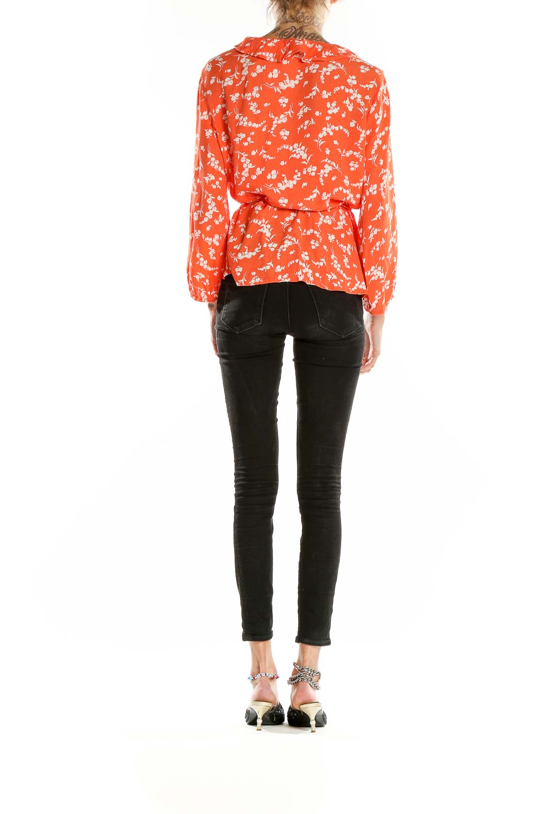 Back view of Gap orange floral wrap blouse showing relaxed fit and long sleeves