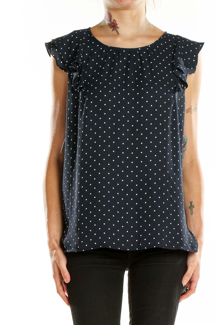 Front view of LOFT navy polka dot blouse with flutter sleeves