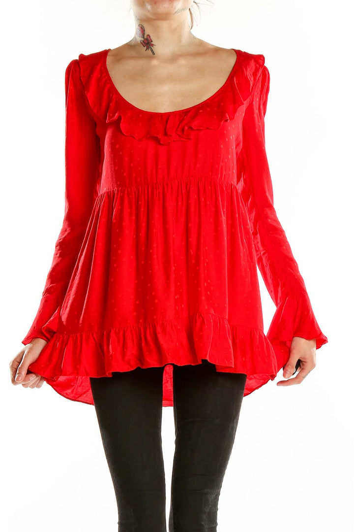 Front view of red ruffled long sleeve babydoll top by For Love & Lemons