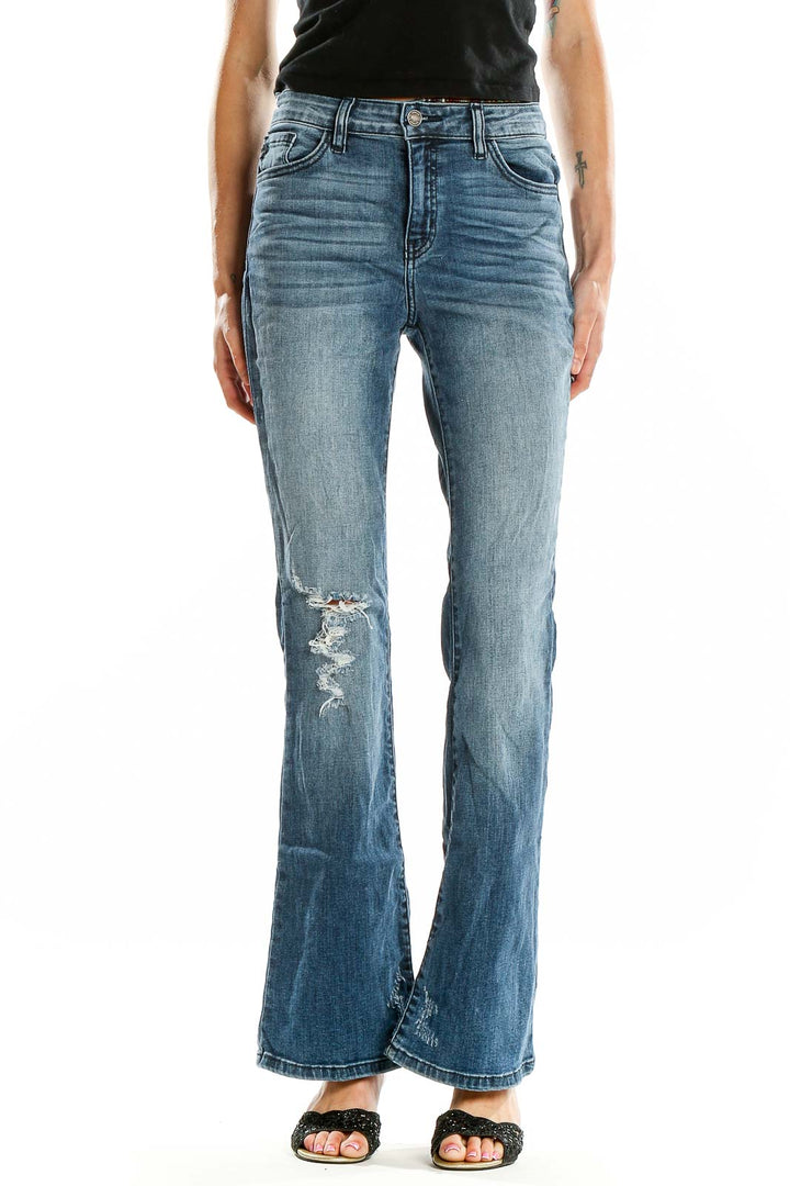 Front view of Kancan blue distressed flare jeans on model