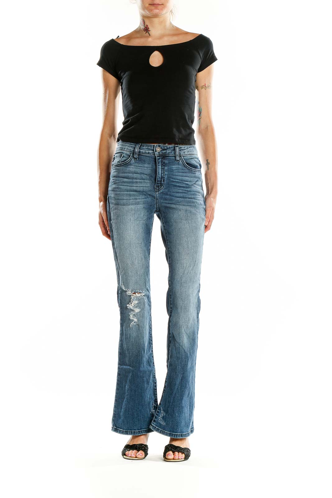 Front view of Kancan blue distressed flare jeans on model