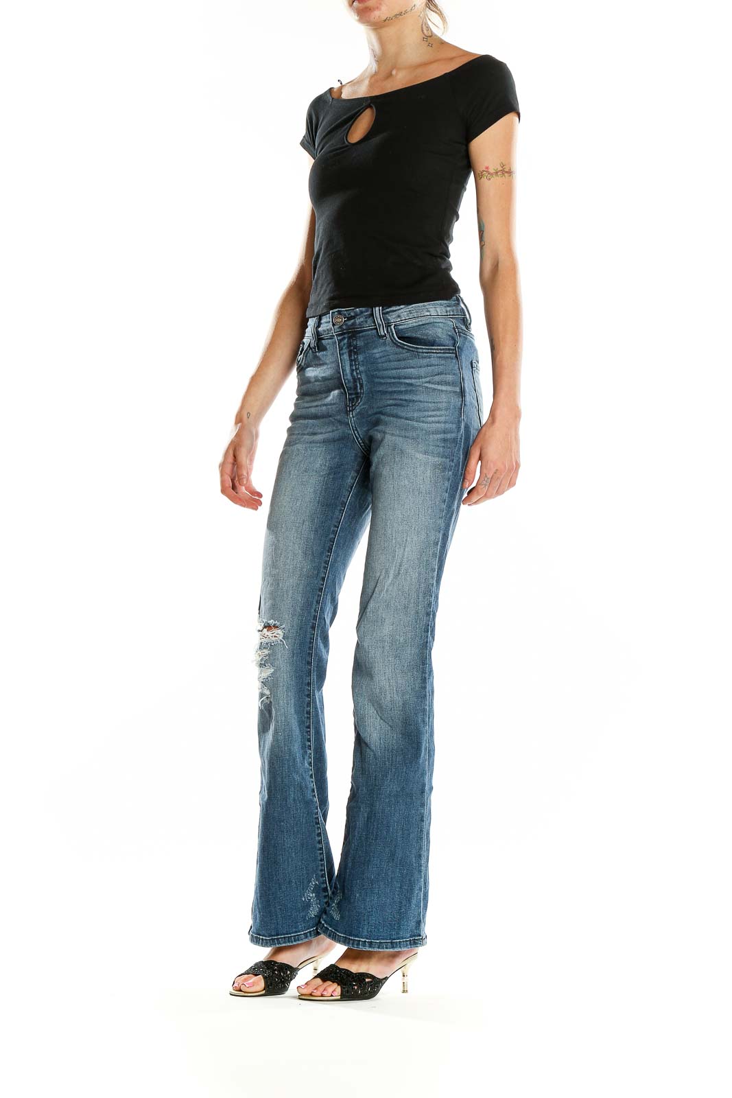 Front view of Kancan blue distressed flare jeans on model