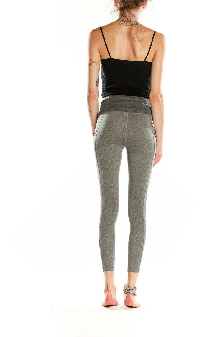 Side view of woman wearing Patagonia gray high-waisted yoga leggings