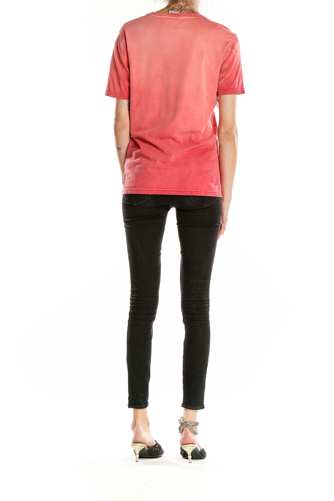 Back view of coral ombre Timberland cotton t-shirt on model with black pants